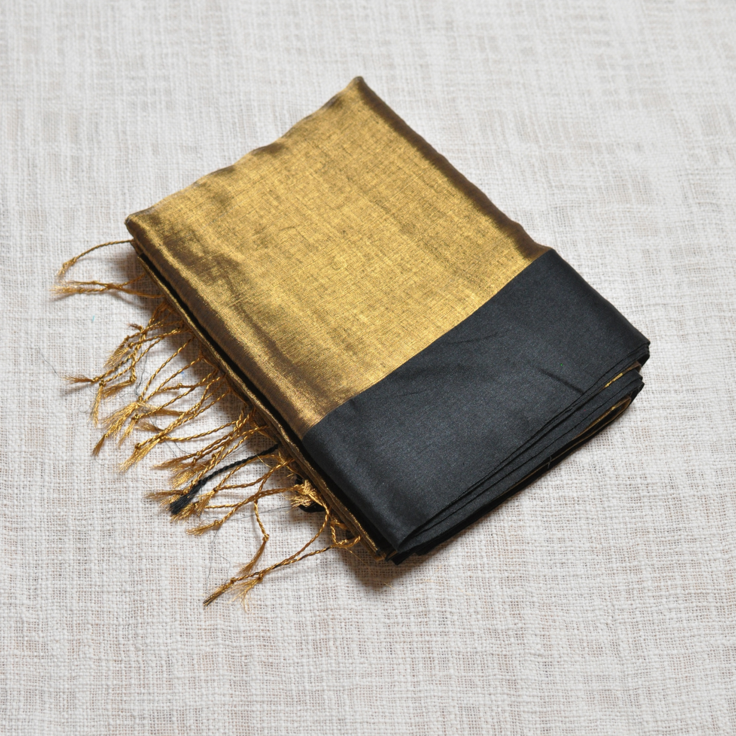 Royal Elegance – Golden Body Black Border Tissue Saree with Matching Blouse Piece ✨